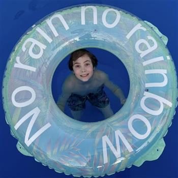 Shea smiling in a pool